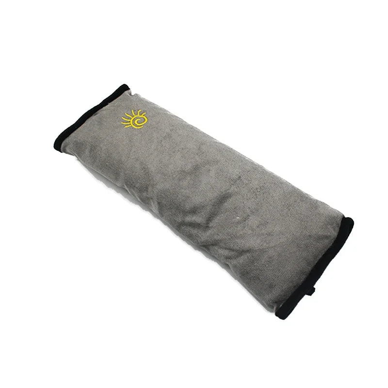 Gray shoulder cushion with a yellow sun design for a universal car seat belt.