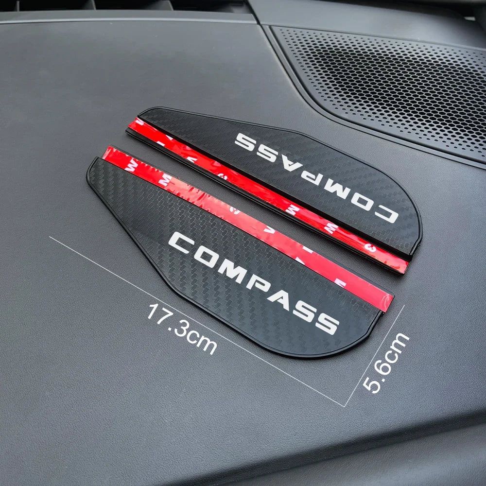 Black carbon fiber texture rain visors with red accents displayed on a dark vehicle surface.