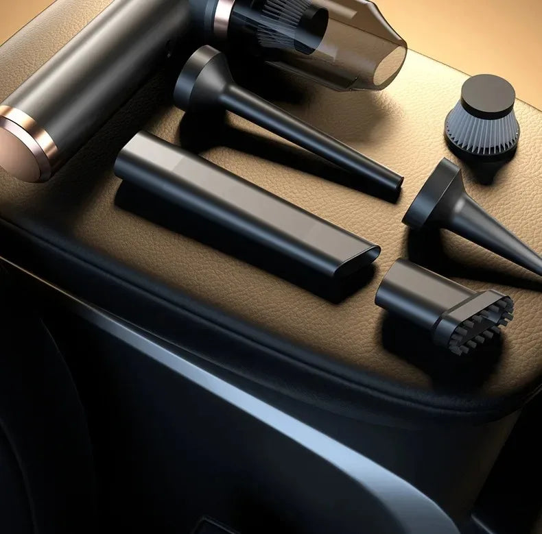 A collection of black and bronze vacuum attachments for a portable wireless car vacuum device.