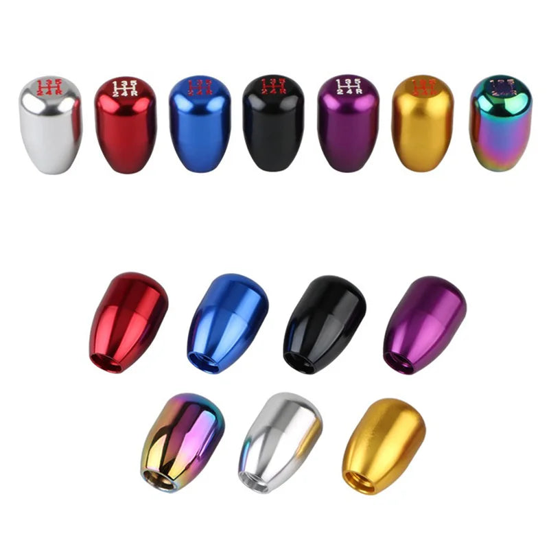 A collection of various colored aluminum gear shift knobs for manual transmissions.