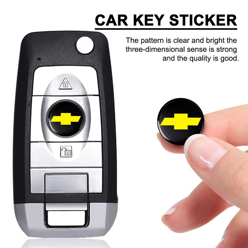 A black car key sticker showing a yellow Chevrolet emblem and a silver key blade.