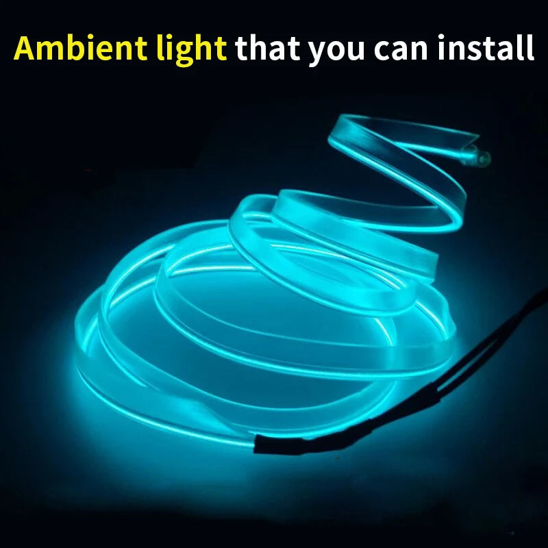 Flexible blue LED strip light coiled and glowing, designed for ambient car interior lighting.