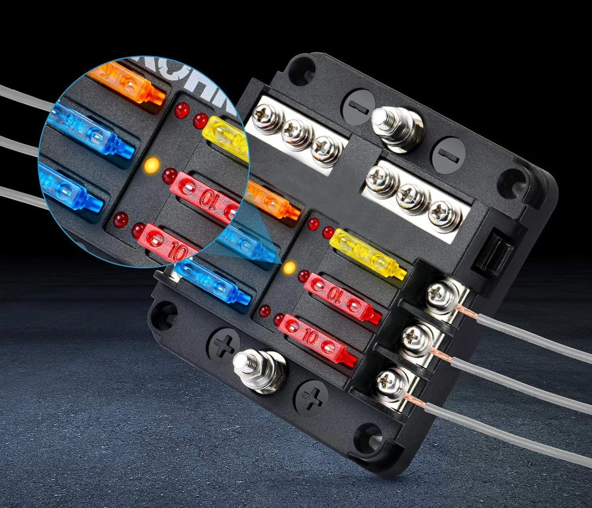 An assortment kit of blade fuses for automotive, showing various colored fuses in a black plastic holder.