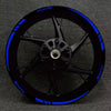 Black sports motorcycle wheel with blue accents and decals