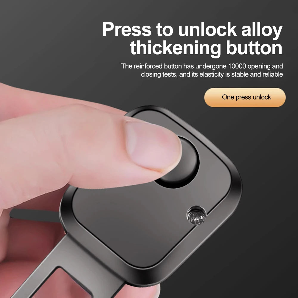 A hand is pressing a button on a black car seat belt extender to unlock alloy thickening.