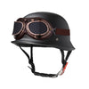 A black half-helmet with attached goggles and a strap, designed for motorcycle or EV safety.