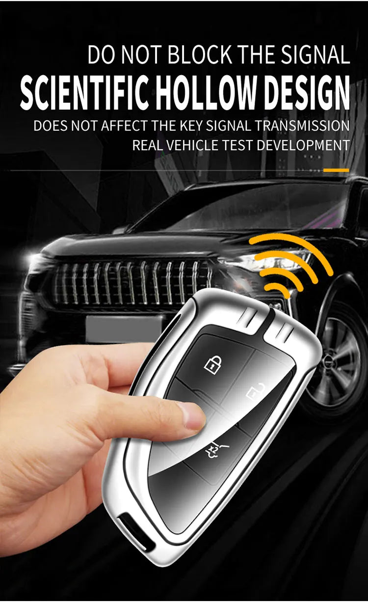 A hand holds a silver car key case with a digital display, demonstrating its design for vehicle signal transmission.