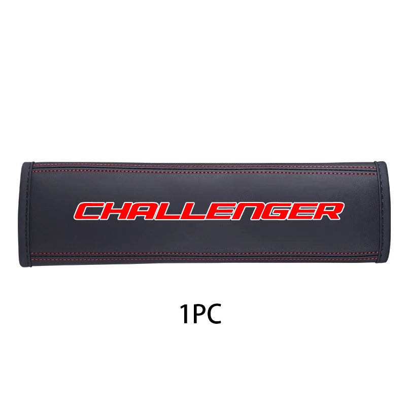 Black leather car seat belt shoulder strap pad with red stitching