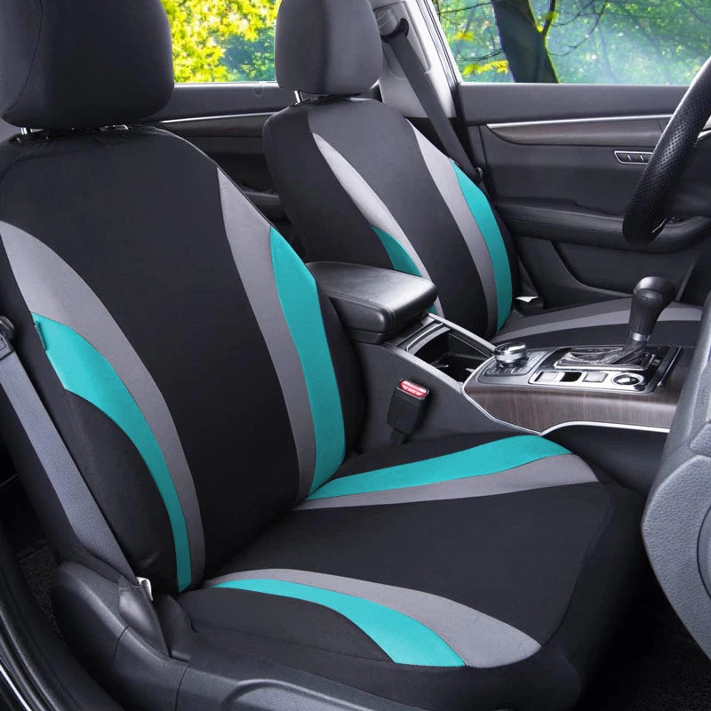 Interior view of a car seat with breathable fabric covers featuring black and teal accents.