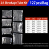A set of black heat shrink tubing kits with various diameters and lengths packaged in plastic bags.