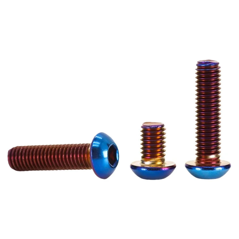 Three titanium blue button head hex bolts of varying lengths and thread pitches.