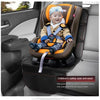 A smiling toddler is seated in a brown and orange car seat protector with blue fabric and safety harness installed in a car i