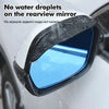 Carbon fiber rain shield protecting a car's rearview mirror from water droplets.