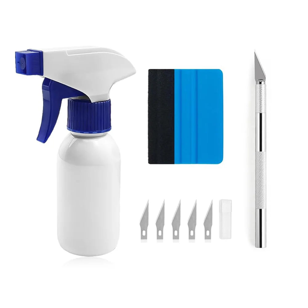 A white automotive film installation tool kit featuring a spray bottle, blade, and various installation tools.