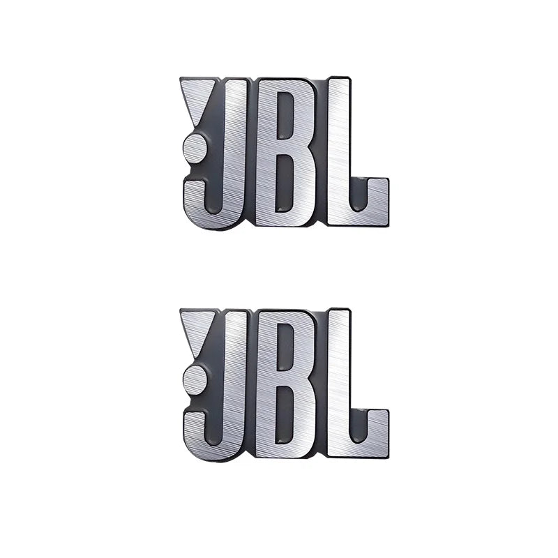 Two silver 3D aluminum JBL car audio emblems displayed side by side.