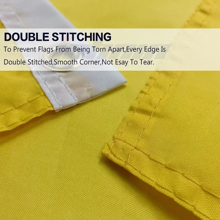 Close-up of yellow fabric showing double stitching on a white edge, demonstrating durable flag construction.