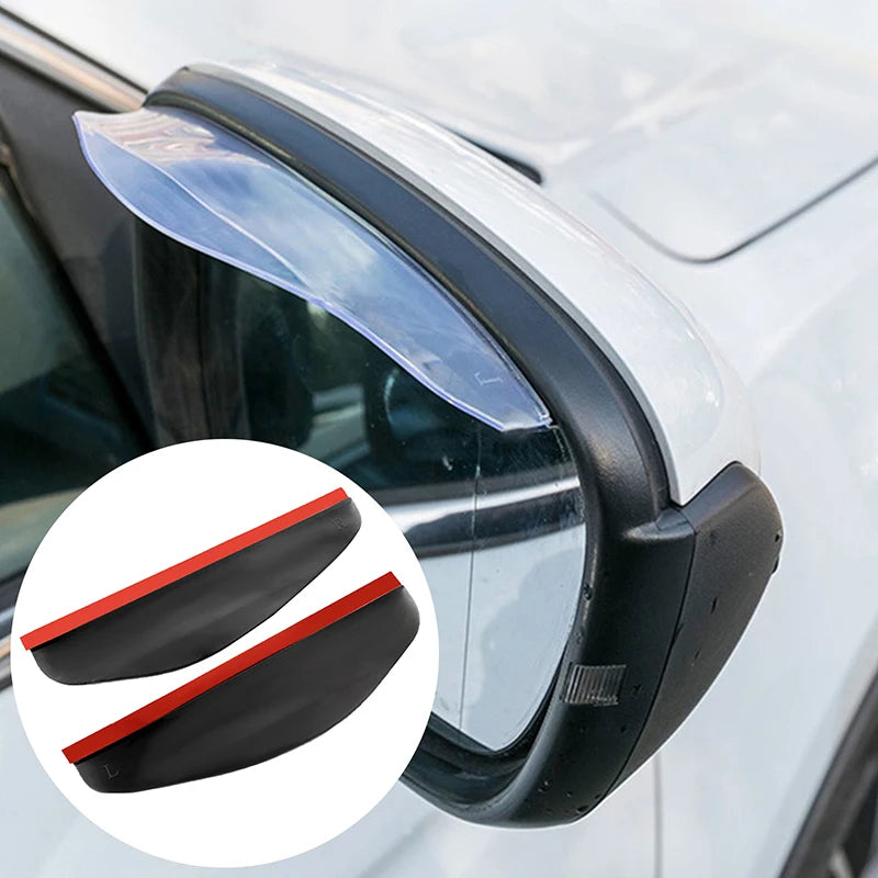 A close-up view of a car's rearview mirror with clear plastic rain and dust visors installed.