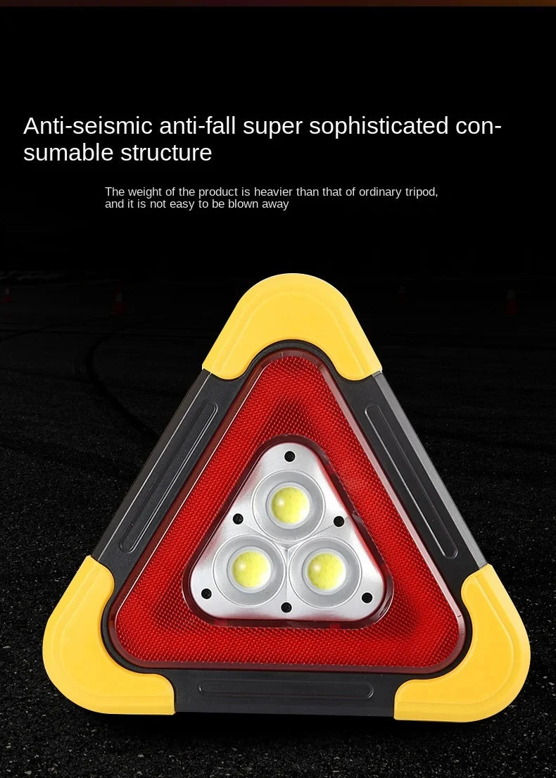 A triangular emergency warning light with a red lens and yellow casing, designed as a self-sustaining structure.