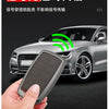 A hand holds a sleek gray alloy car key case, demonstrating its use for signal-free transmission.