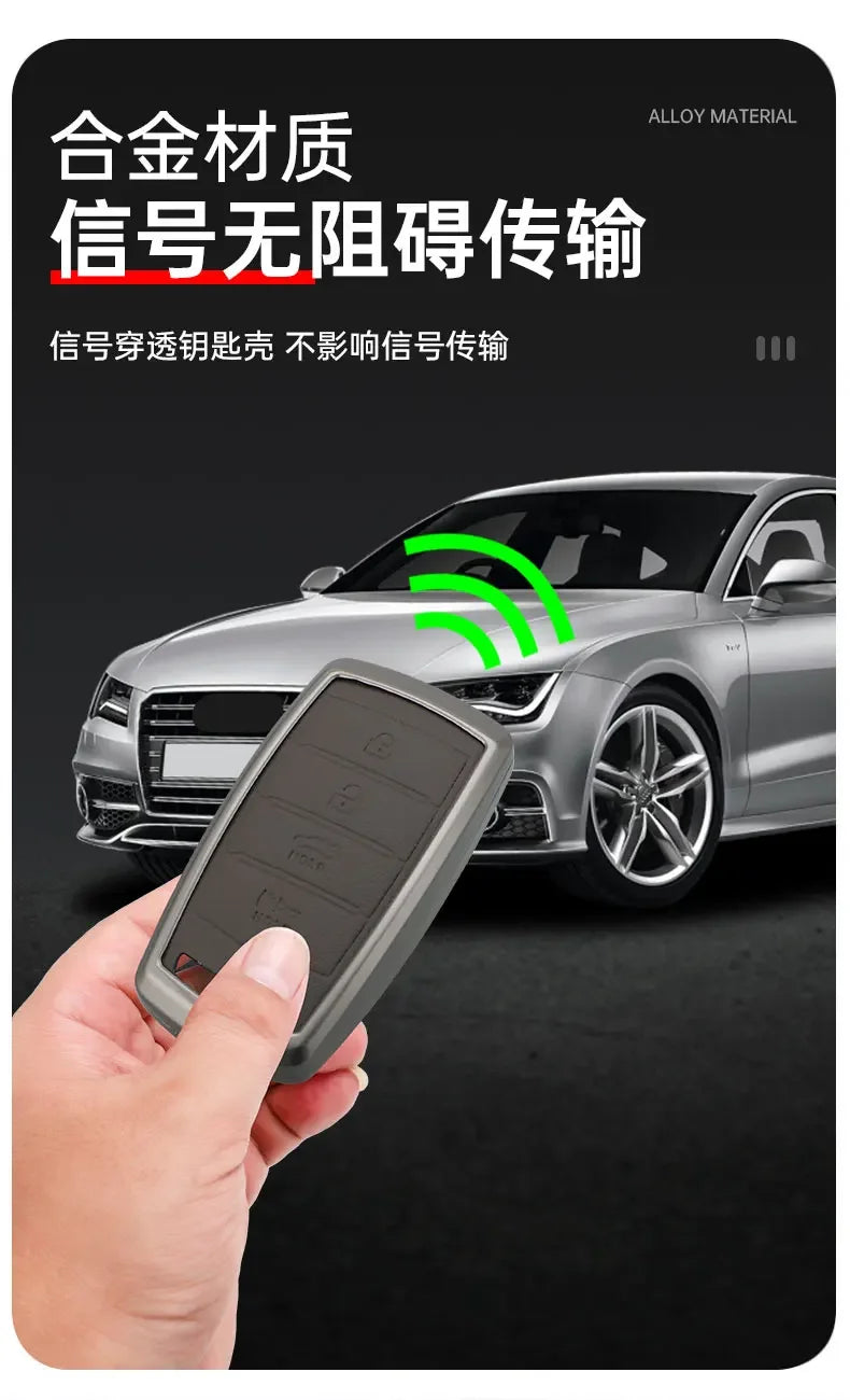 A hand holds a sleek gray alloy car key case, demonstrating its use for signal-free transmission.