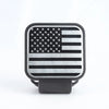 A black square universal trailer hitch cover featuring a silver American flag design.