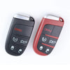 A black car key fob shell replacement housing with a red accent, showing various buttons.