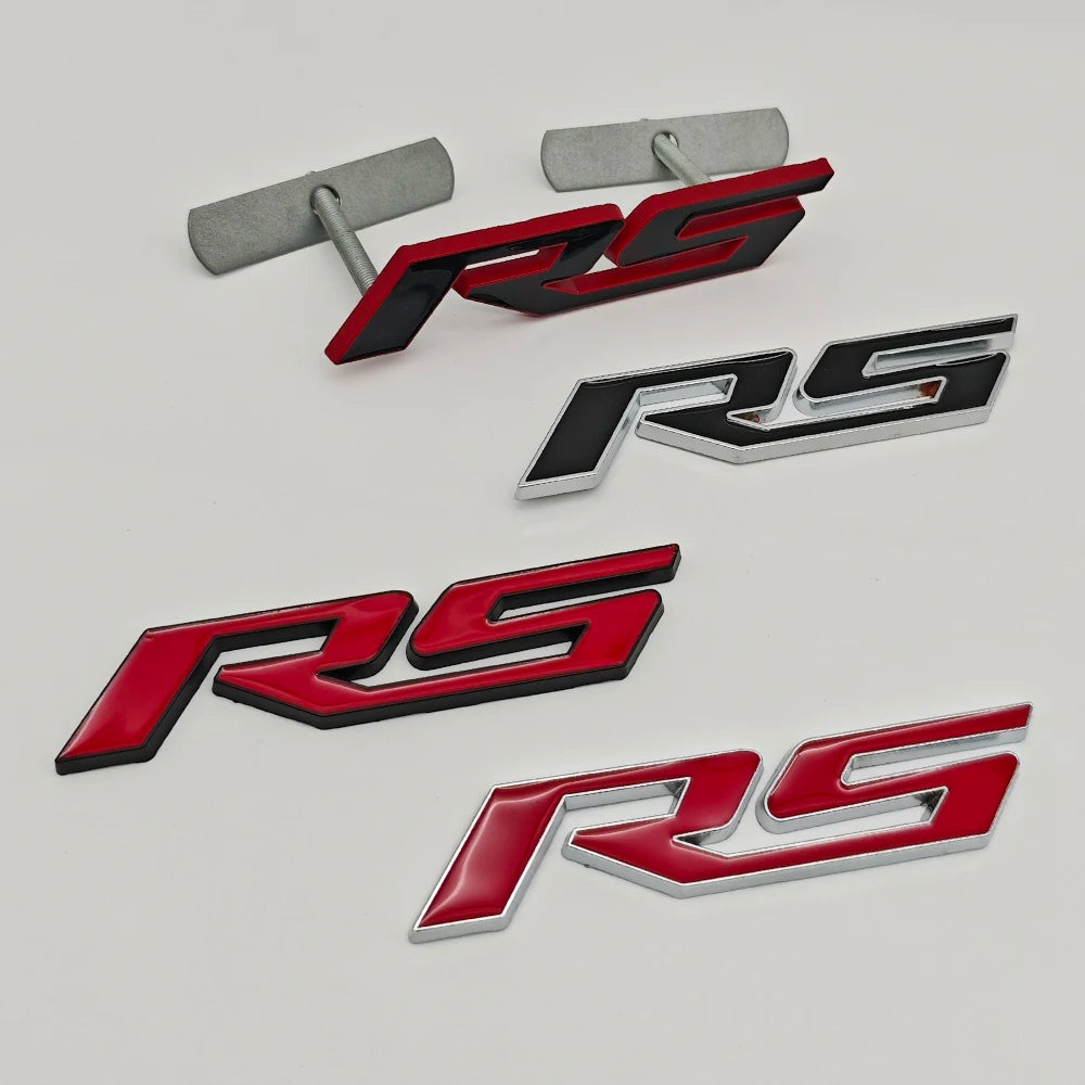 Three variations of a 3D metal SS/RS emblem badge for Chevrolet vehicles in black, silver, and red.