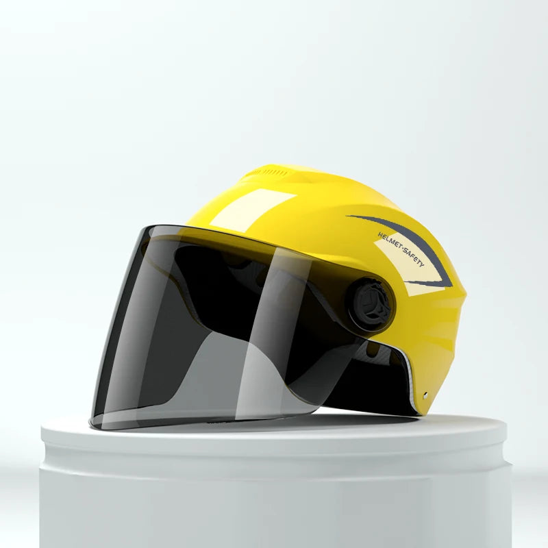 A yellow lightweight rainproof half helmet with a clear visor is displayed on a white stand.