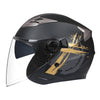 A black motorcycle helmet with a clear visor and gold-colored graphic accents.