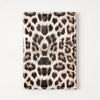 A black and tan leopard print passport holder with card slots.