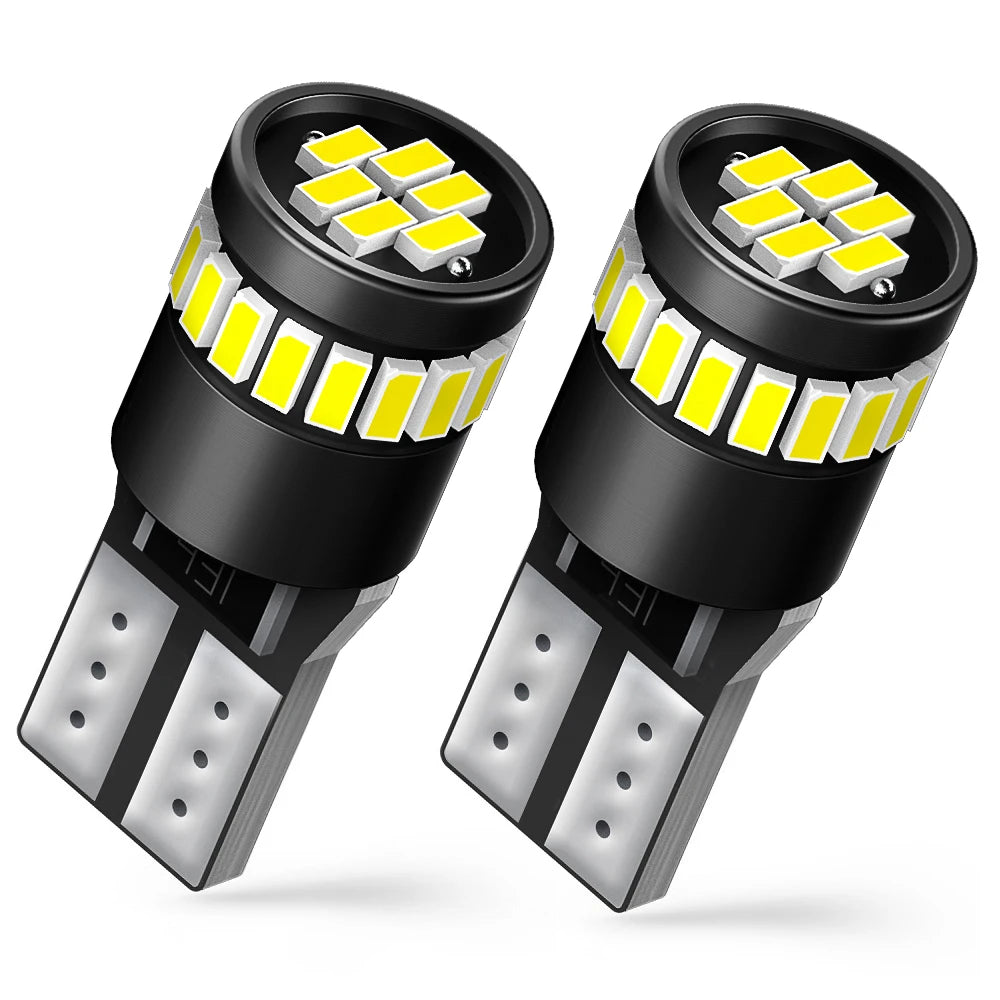 A pair of Canbus Error-Free T10 LED bulbs with yellow light visible.
