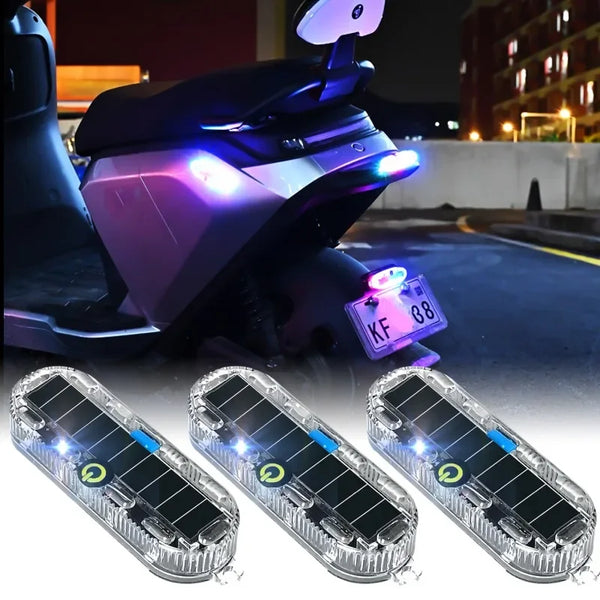 A solar LED warning light for vehicles is shown alongside three solar panels.