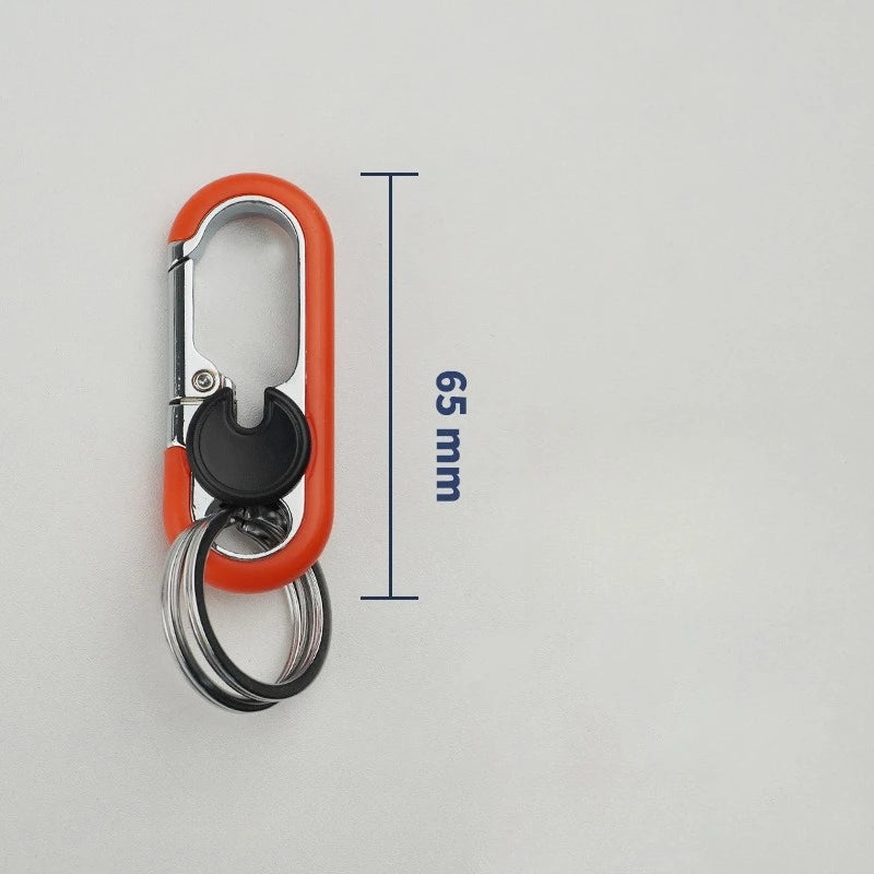An orange carabiner keychain with a silver split ring and a black loop, shown against a white background.