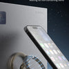 A smartphone ring stand is magnetically attached to a refrigerator, demonstrating magnetic adsorption for closing.