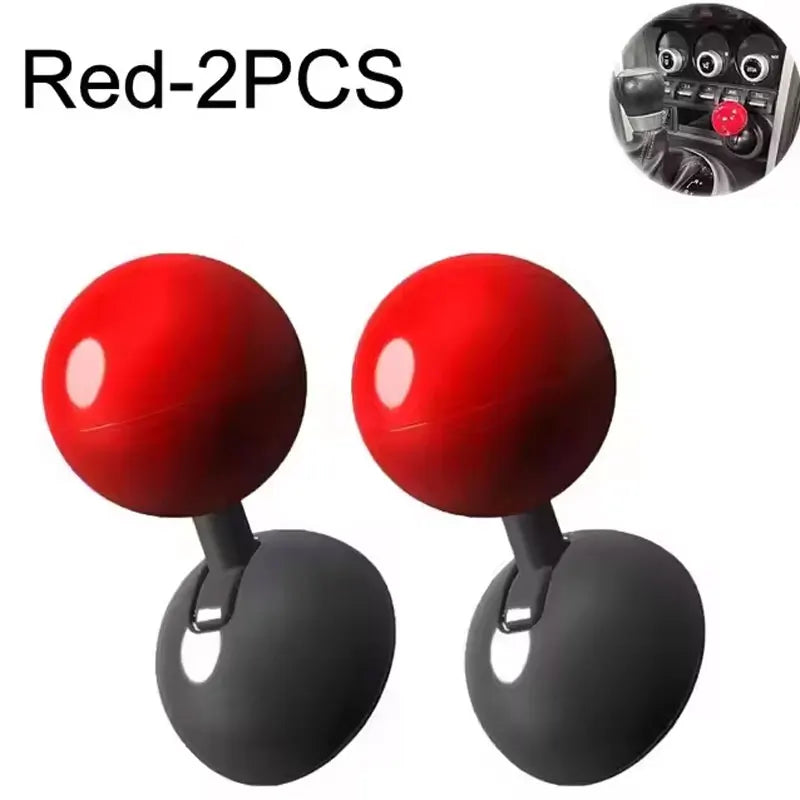 Two red push start ignition button covers with black bases shown side by side.
