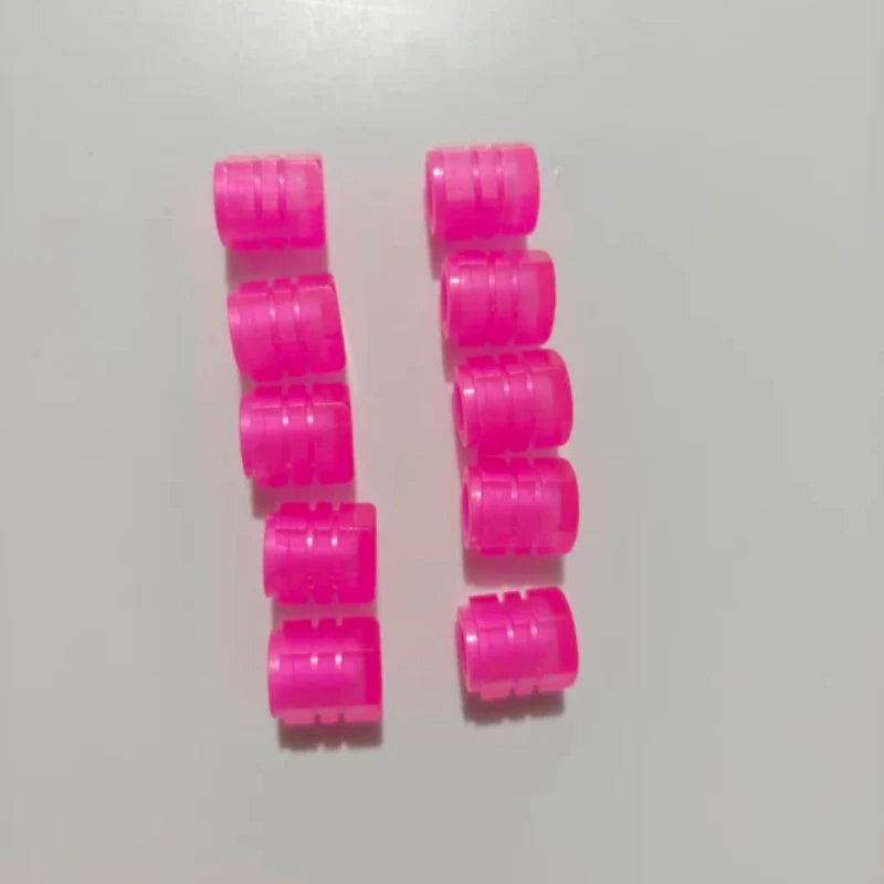 Collection de bouchons de valve de pneu lumineux rose vif pour automobile et vélo.