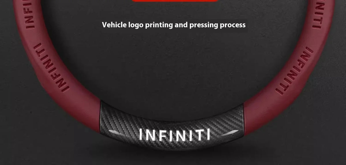 A close-up view of a red steering wheel cover for an Infiniti vehicle, showing the logo printing and pressing process.