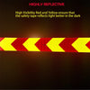 A yellow and red high-visibility reflective safety tape strip with chevron markings against a dark background.