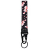 Black wrist strap lanyard featuring a pattern of pink cherry blossoms