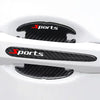 Black carbon fiber scratch protection film applied to a white car door handle.