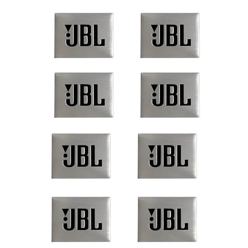 A set of six square metal emblems with the JBL logo embossed on them.