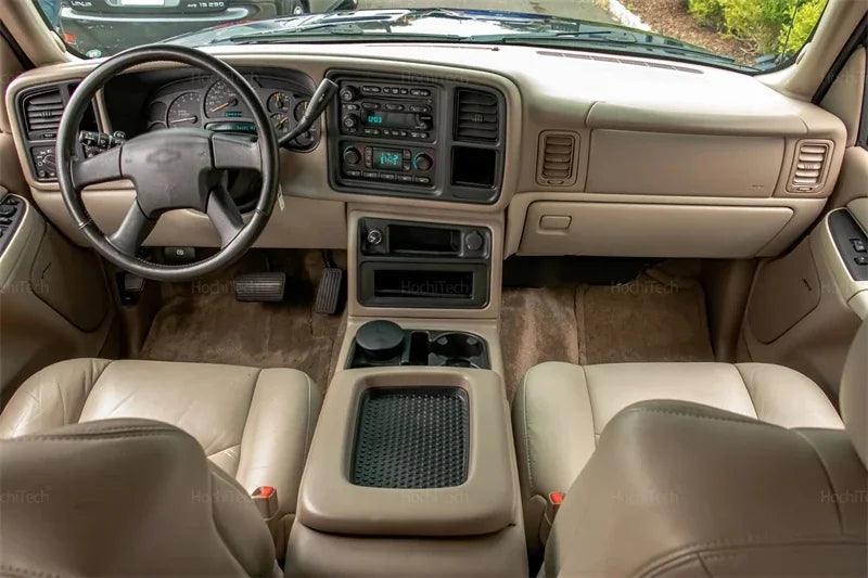 Interior view of a Chevrolet Silverado showing the dashboard, steering wheel, and front seats.