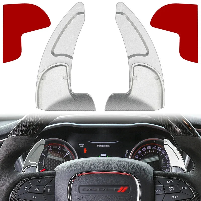Close-up view of a CNC aluminum steering wheel paddle shifter mechanism and controls.