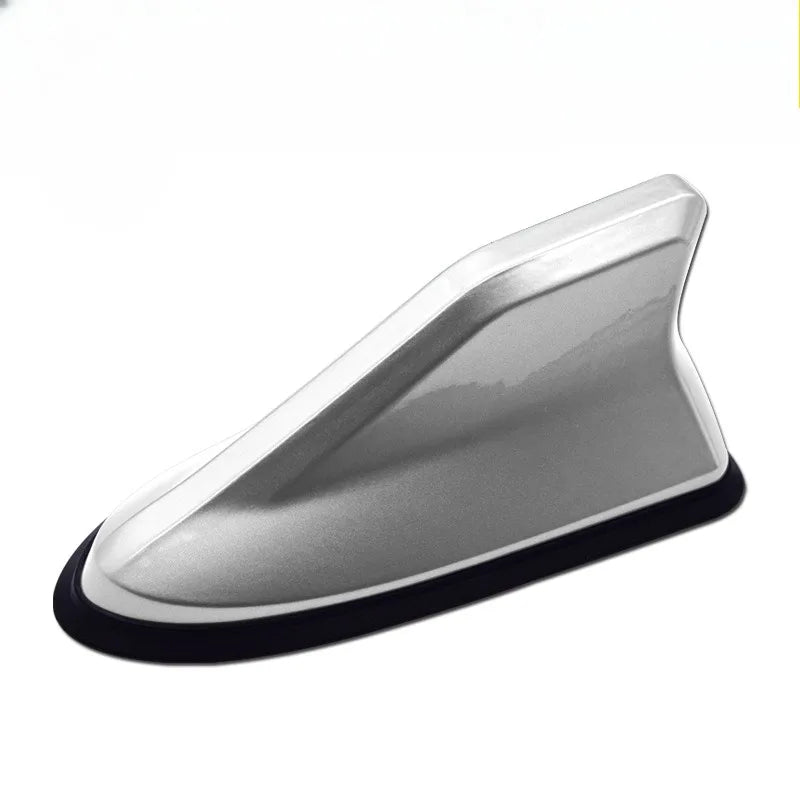 Silver shark fin universal car antenna amplifier with a black base