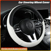 A white perforated Nappa leather steering wheel cover installed on a black car steering wheel.
