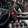 Close-up view of an all-metal cylindrical car start button accessory installed on a vehicle's interior dashboard.