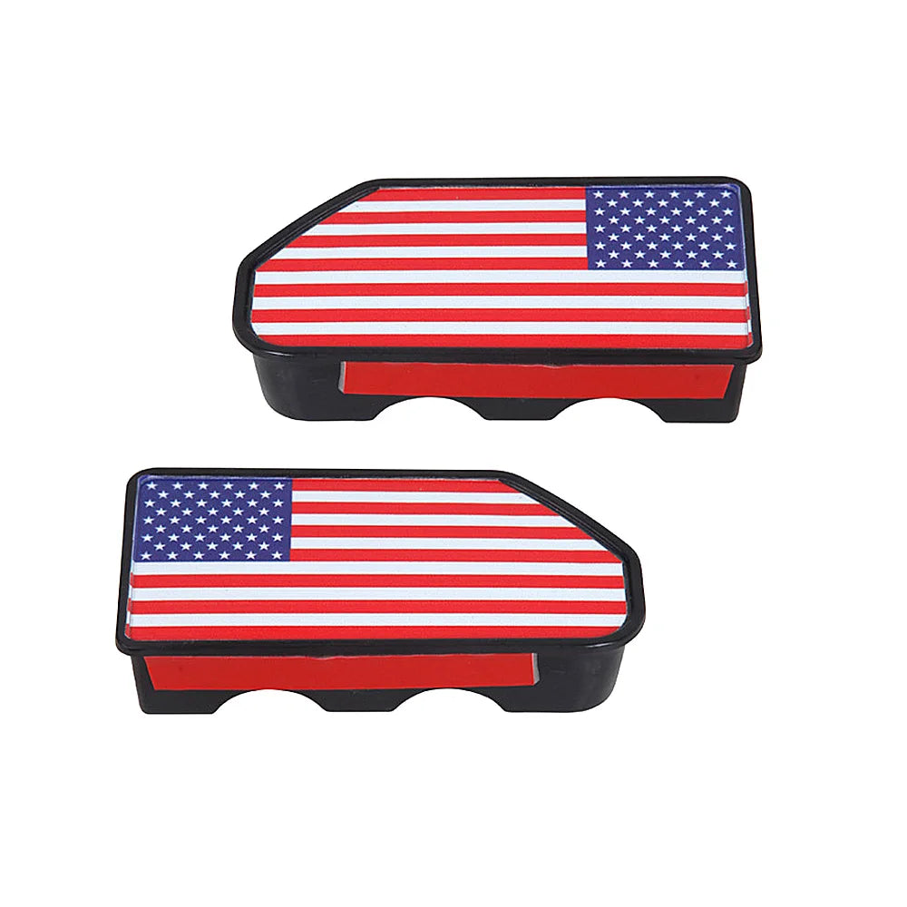 Two rectangular truck bed rail hole plugs featuring the American flag design in red, white, and blue.