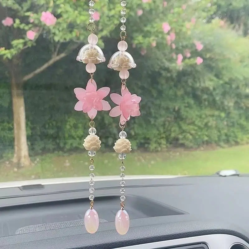 Pink lotus car pendant ornament featuring layered floral charms and a dangling pearl drop