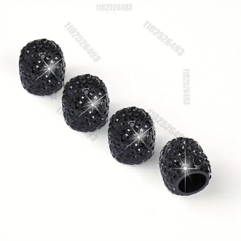 A set of black crystal diamond finish tire valve caps.