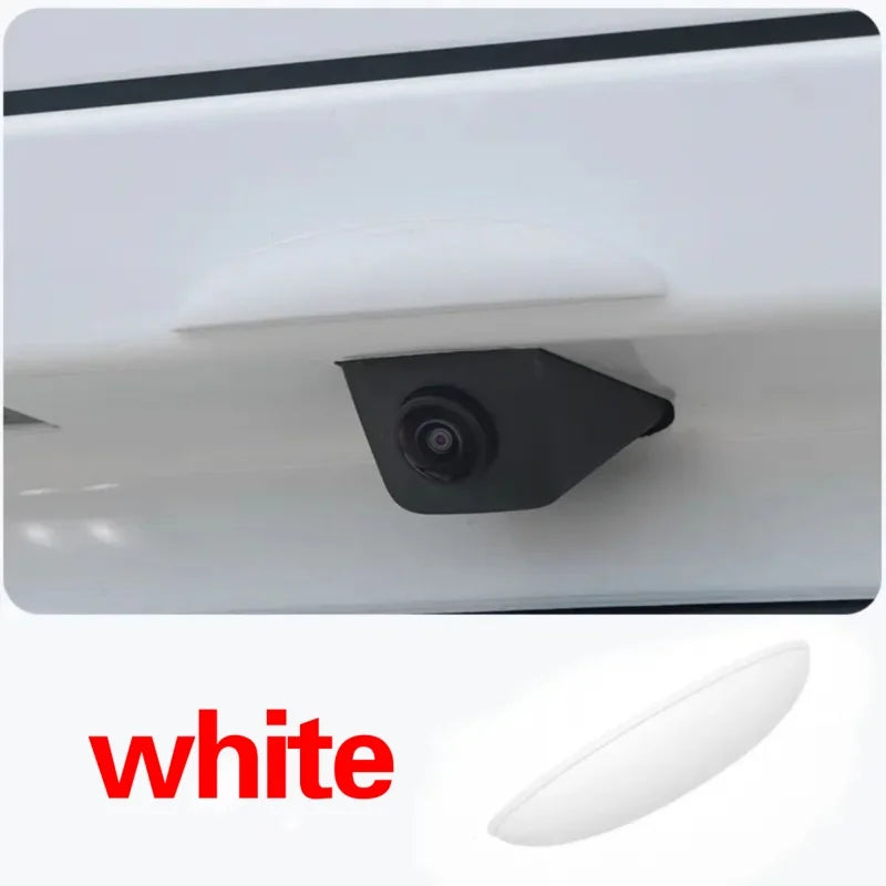 A white anti-fog waterproof rain cover for a rear camera is shown in a close-up view.